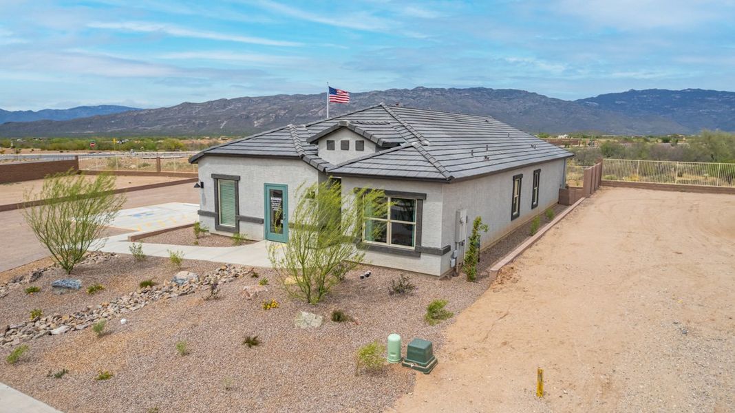 Front exterior of a home in the The Oasis at Rocking K community, located in Vail, AZ (Image 13).