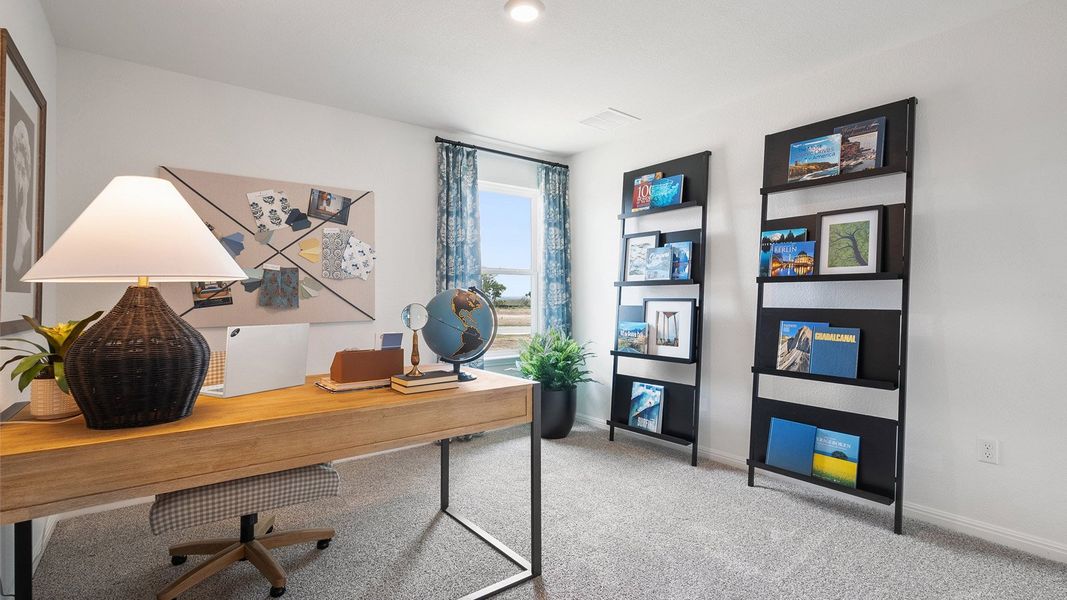 Furnished interior in a model home at Monarch Ranch in Manor (Image 29).