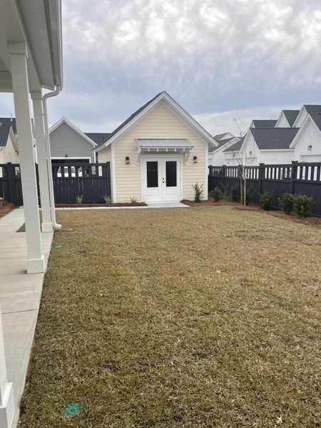 Charming backyard in The Domus Collection at Midtown Nexton by New Leaf Builders, featuring a small cottage in Summerville, SC. Charming backyard in The Domus Collection at Midtown Nexton by New Leaf Builders, featuring a small cottage in Summerville, SC.