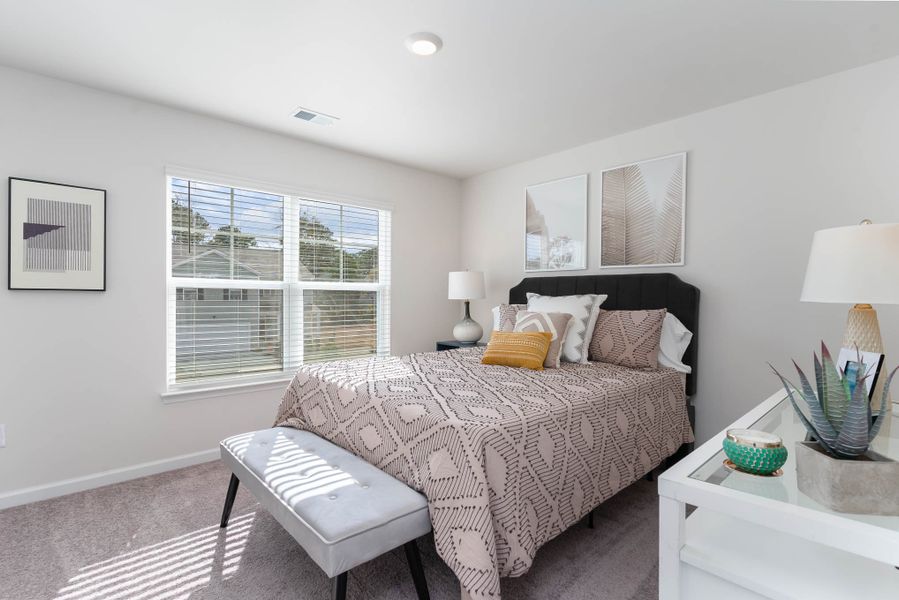 Furnished interior in a model home at Island Green in Myrtle Beach (Image 46).