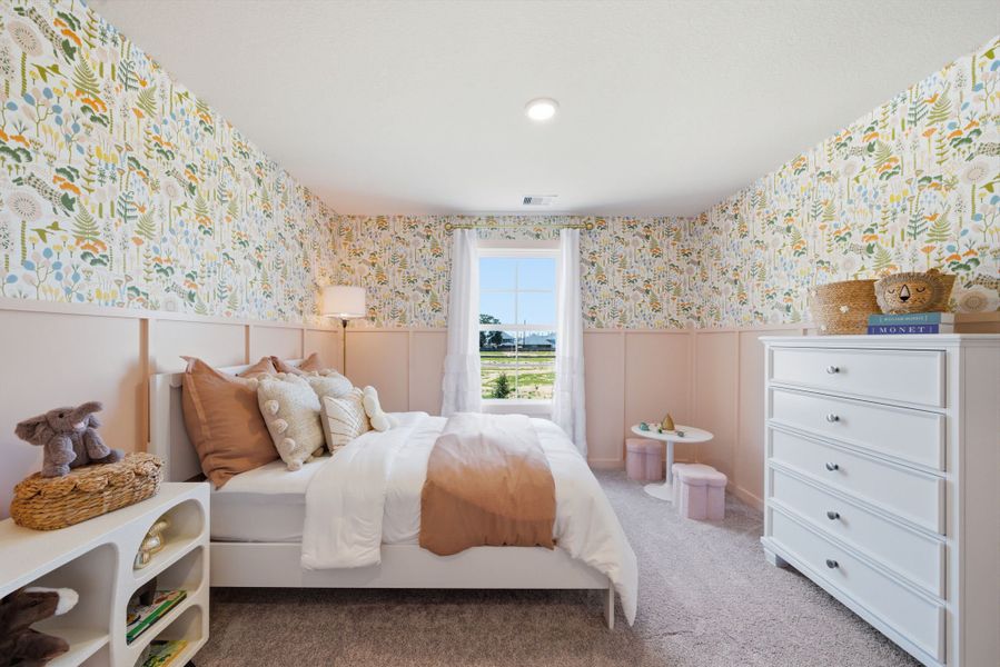 A bedroom with a bed and a dresser. A bedroom with a bed and a dresser.