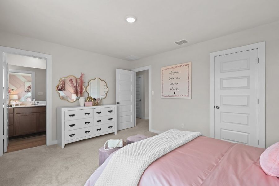 A bedroom with a bed and dresser. A bedroom with a bed and dresser.