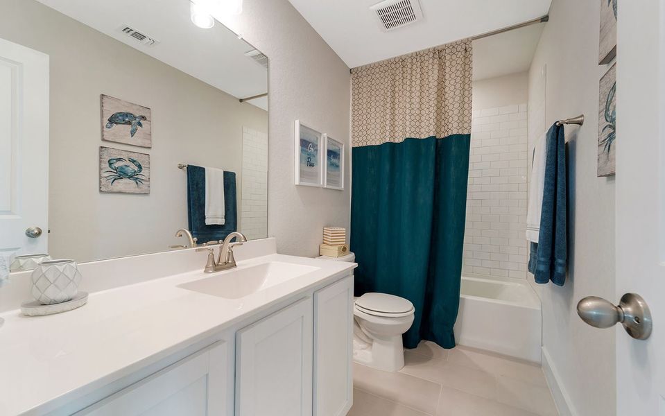 Furnished interior in a model home at Hunter's Ranch in San Antonio (Image 34).