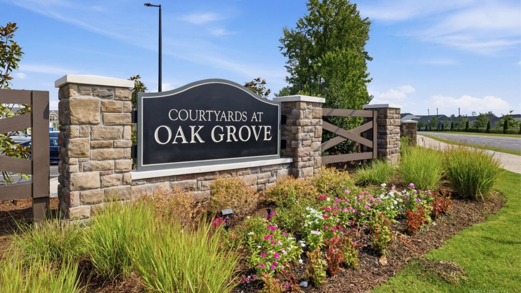 Entrance to the The Courtyards at Oak Grove community in Durham, NC, featuring signage and landscaping (Image 2). Entrance to the The Courtyards at Oak Grove community in Durham, NC, featuring signage and landscaping (Image 2).