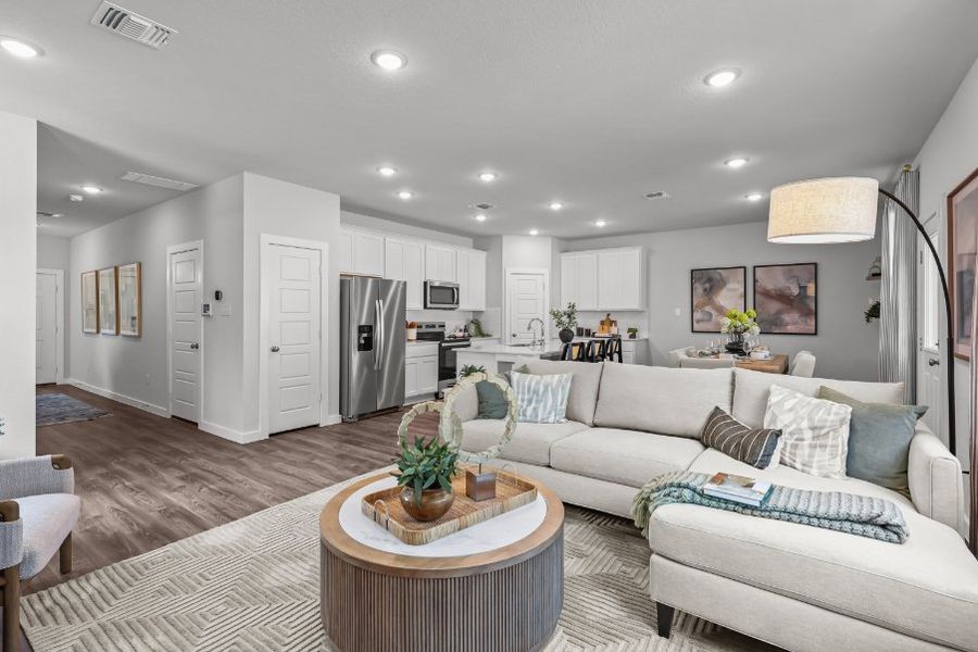 A living room with a couch and a table. A living room with a couch and a table.