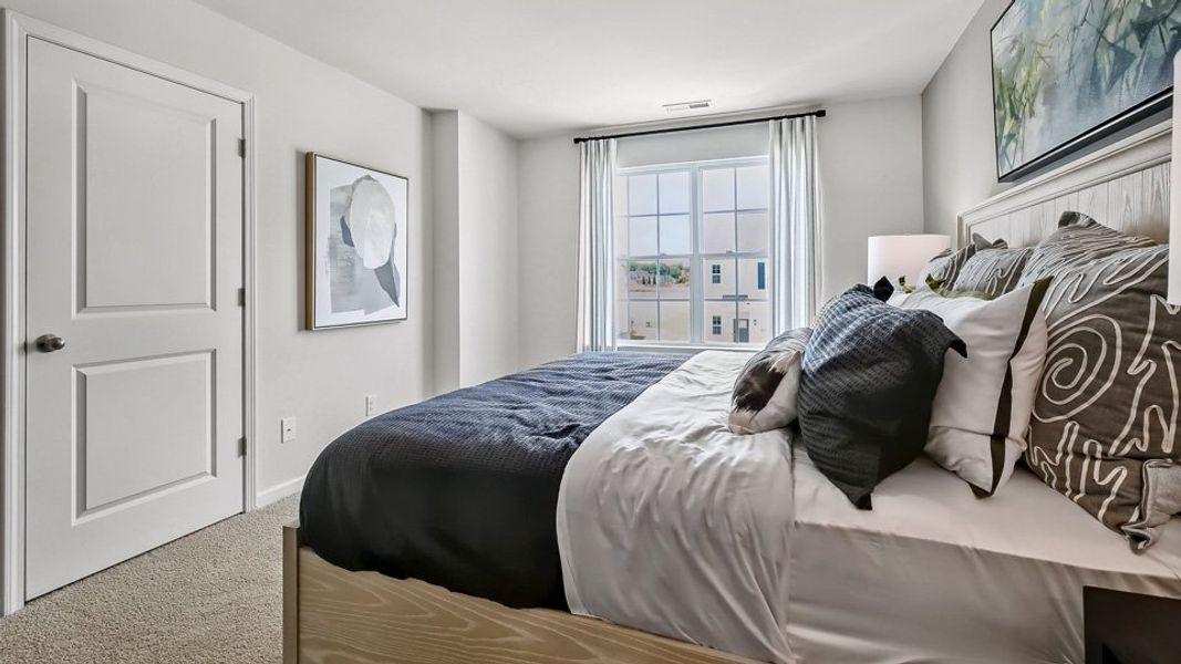 Furnished interior in a model home at The Townes at Prestleigh in Wake Forest (Image 25).