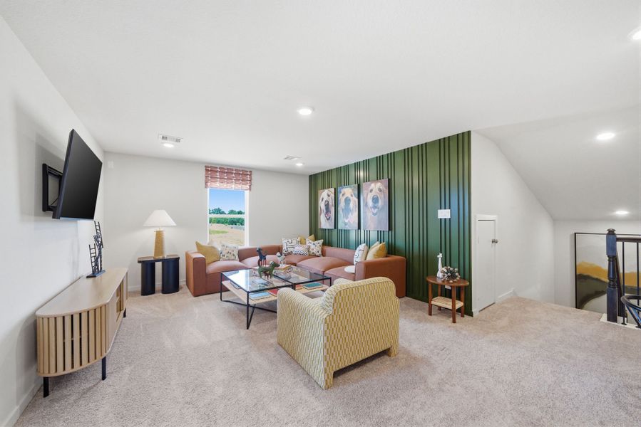 A living room with a couch and a tv. A living room with a couch and a tv.
