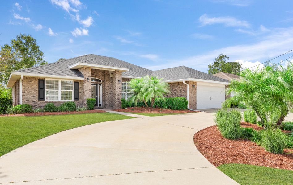 Front exterior of a home in the Palm Coast community, located in Palm Coast, FL (Image 10).