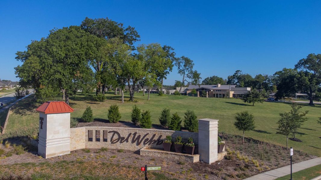 Entrance to the Trinity Falls community in McKinney, TX, featuring signage and landscaping (Image 25).