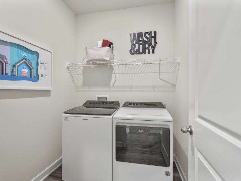 A separate laundry room equipped with a utility sink is a great convenience.