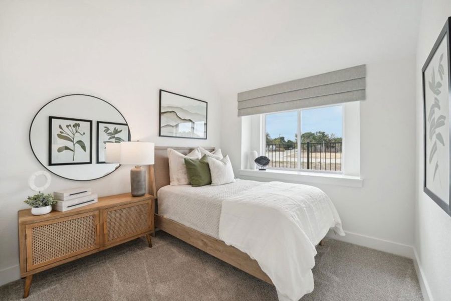 Furnished interior in a model home at Grande Estates in Bertram (Image 8).