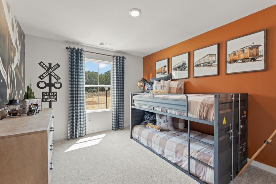 A bedroom with a bed and a window. A bedroom with a bed and a window.
