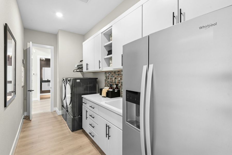 Furnished interior in a model home at Caliterra in Dripping Springs (Image 54).