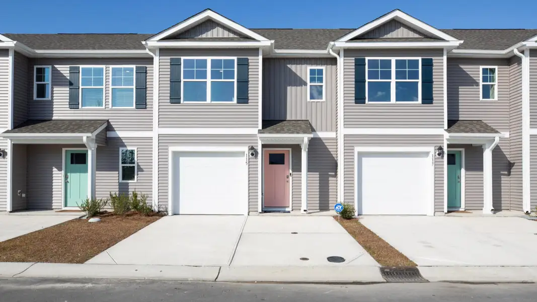 Front exterior of a home in the Waterside Townhomes community, located in Surf City, NC (Image 2).