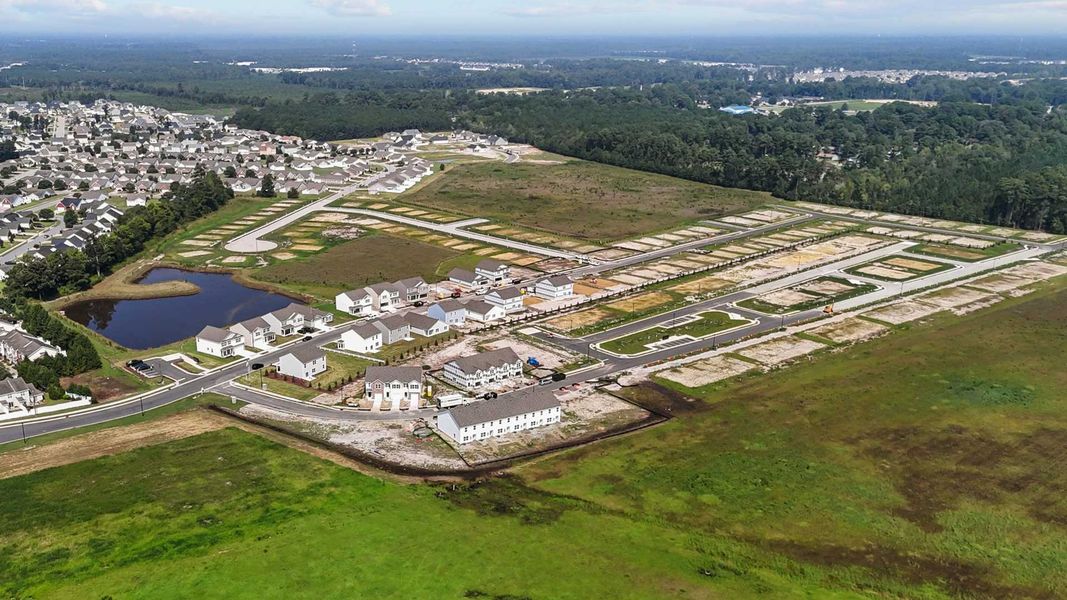 Aerial view of the The Townes at Ridgewood Farms community in Winterville, NC, showing layout and nearby surroundings (Image 1).