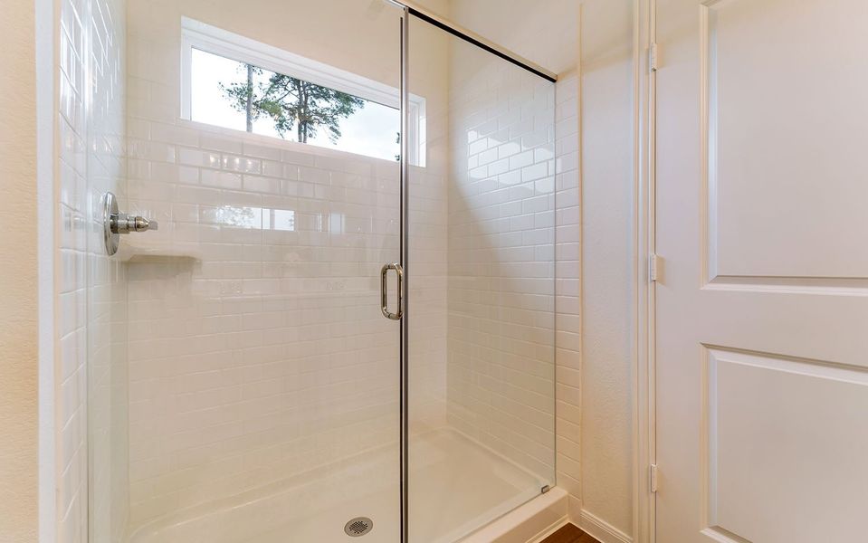 Furnished interior in a model home at The Pines at Seven Coves in Willis (Image 27).