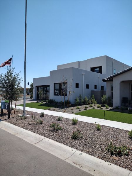 A modern white home with sleek lines and a landscaped yard in Ascent at Avalon Crossing by Shea Homes (Mesa, AZ). A modern white home with sleek lines and a landscaped yard in Ascent at Avalon Crossing by Shea Homes (Mesa, AZ).