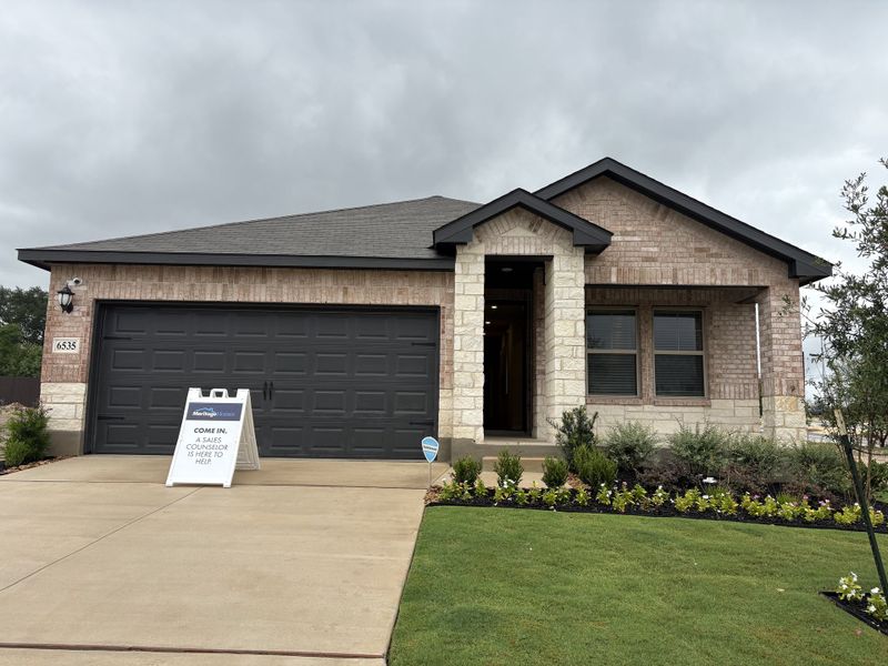 A charming brick home with manicured landscaping in Royal Crest by Meritage Homes (San Antonio, TX). A charming brick home with manicured landscaping in Royal Crest by Meritage Homes (San Antonio, TX).