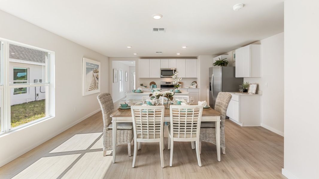 Furnished interior in a model home at Cali Cove in Punta Gorda (Image 17).