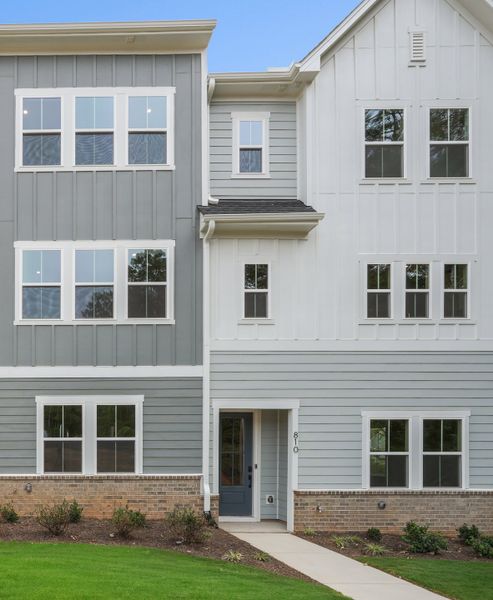 Front exterior of a home in the Mews at Holding Village community, located in Wake Forest, NC (Image 7).