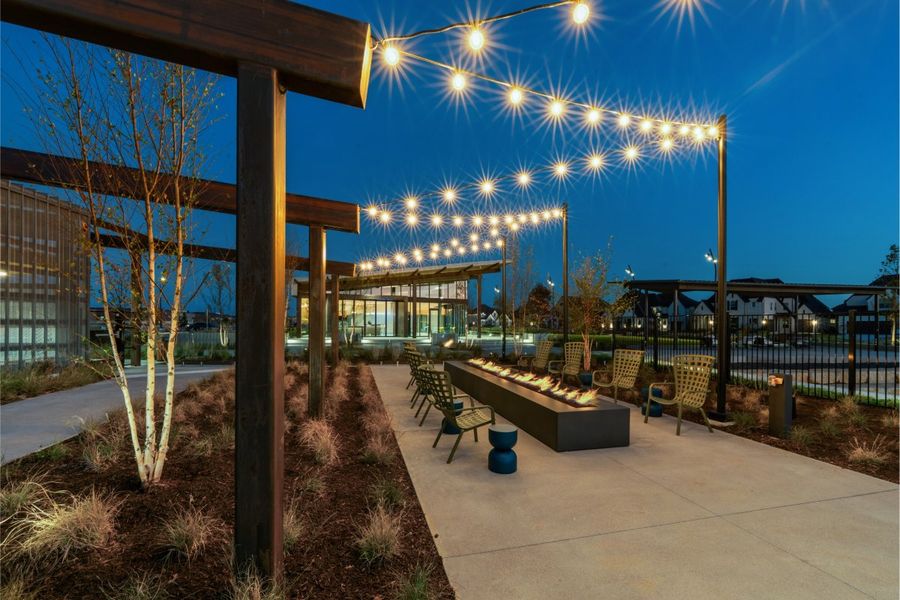 Twilight photo of firepit with string lights in Mosaic, Celina, Texas
