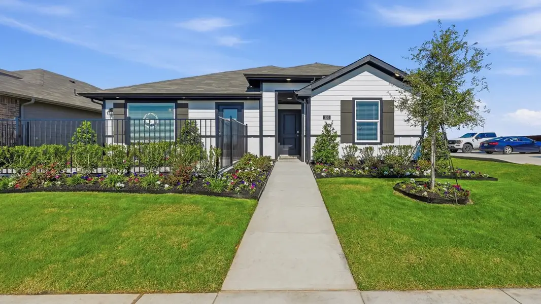 Front exterior of a home in the Lonestar at Liberty Trails community, located in Justin, TX (Image 1). Front exterior of a home in the Lonestar at Liberty Trails community, located in Justin, TX (Image 1).