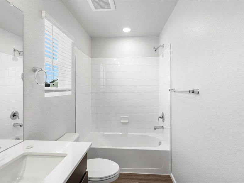 Furnished interior in a model home at Frontier Estates - The Flora Collection in Firestone (Image 21).