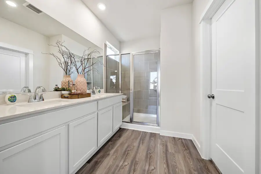 A bathroom with a glass shower.