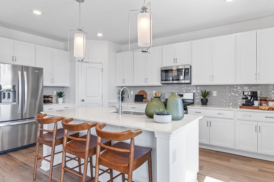 A kitchen with white cabinets. A kitchen with white cabinets.