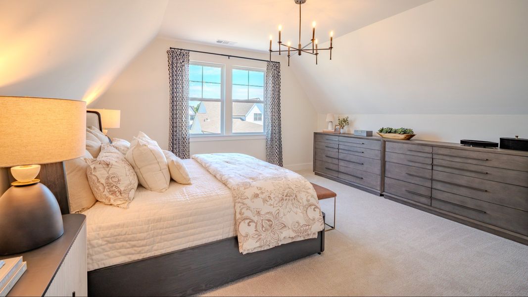 Bedroom with carpet and windows