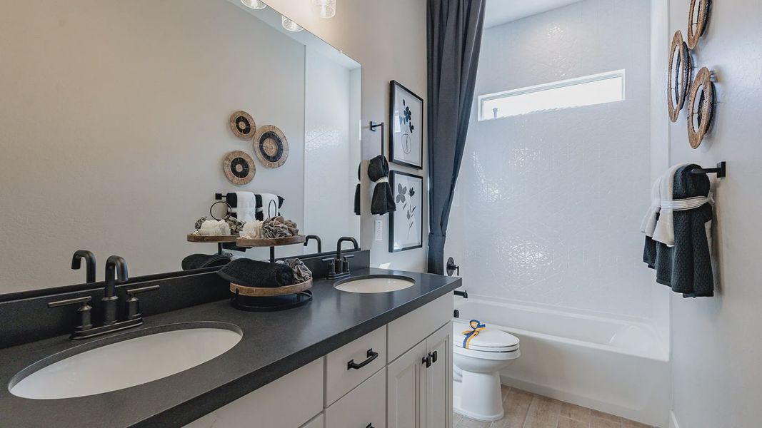 Luxurious dual vanity with black hardware in Arroyo Seco's exquisite Hacienda community. Luxurious dual vanity with black hardware in Arroyo Seco's exquisite Hacienda community.