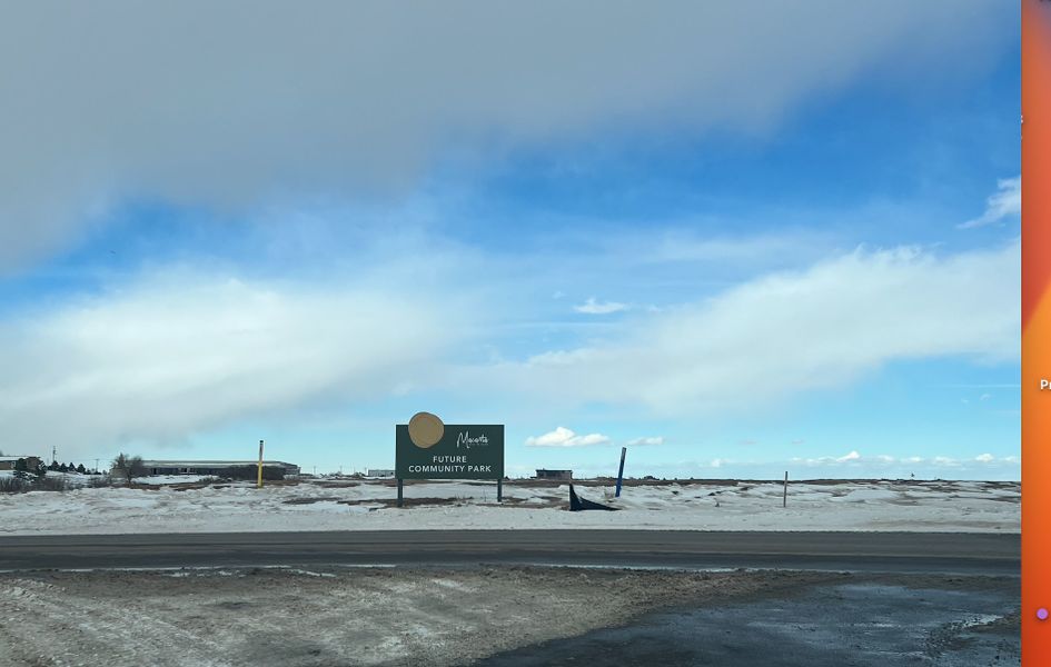 A scenic view of a future park site amid snowy terrain in Macanta: The Grand Collection by Lennar (Castle Rock, CO).