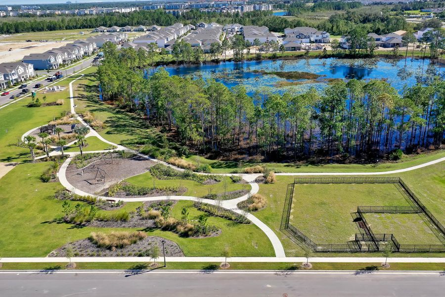Aerial view of the Harvest at Ovation - Townhomes community in Winter Garden, FL, showing layout and nearby surroundings (Image 15).