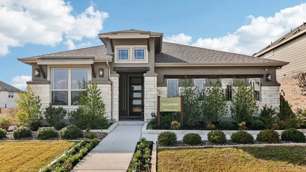 Front exterior of a home in the Meyer Ranch – Premier community, located in New Braunfels, TX (Image 2).