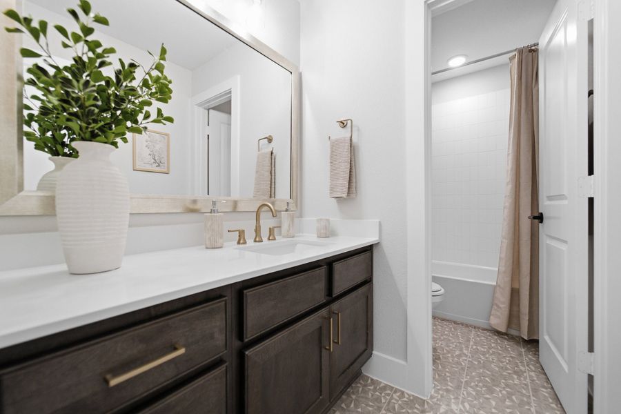 Furnished interior in a model home at Grand Magnolia in Waller (Image 43).