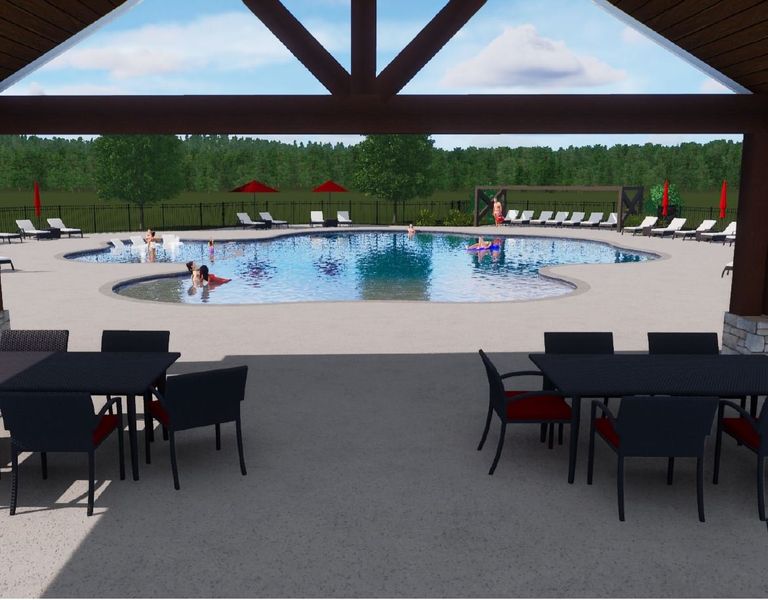 A pool with people in it. A pool with people in it.