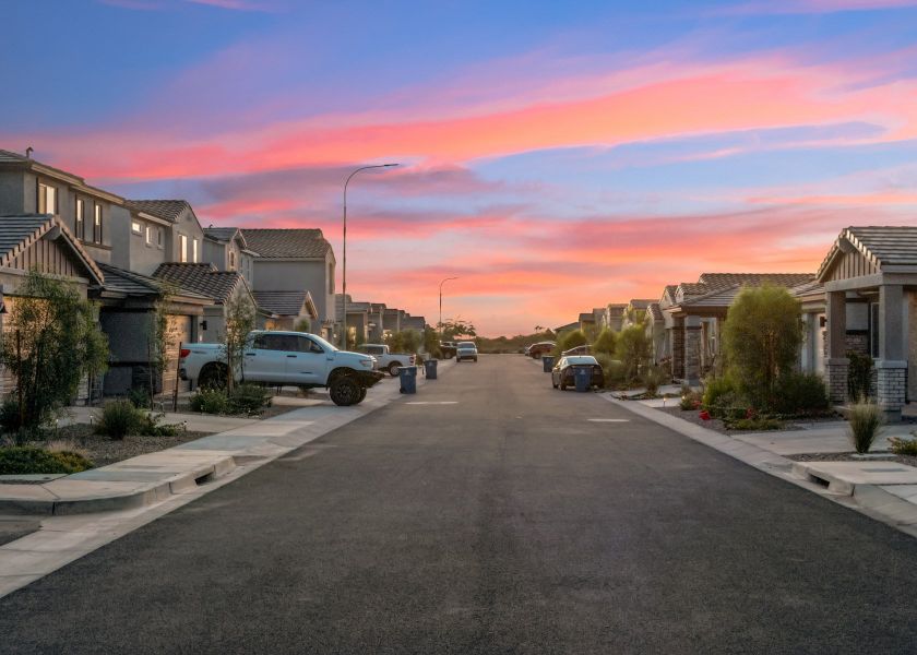 A street with cars parked along it. A street with cars parked along it.