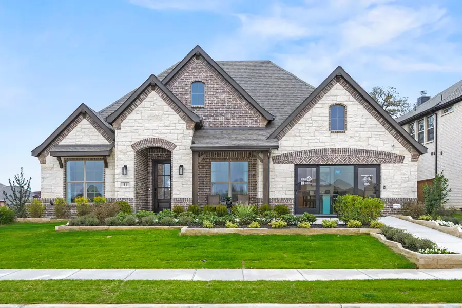 Front exterior of a home in the Mockingbird Hills - Signature Series community, located in Joshua, TX (Image 2).