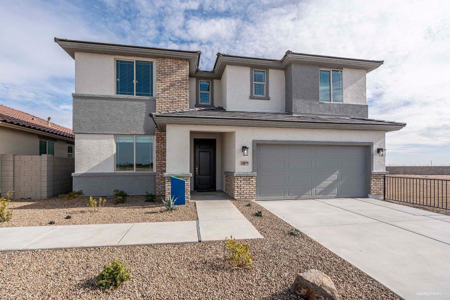 Front exterior of a home in the The Villages at North Copper Canyon – Valley Series community, located in Surprise, AZ (Image 19).