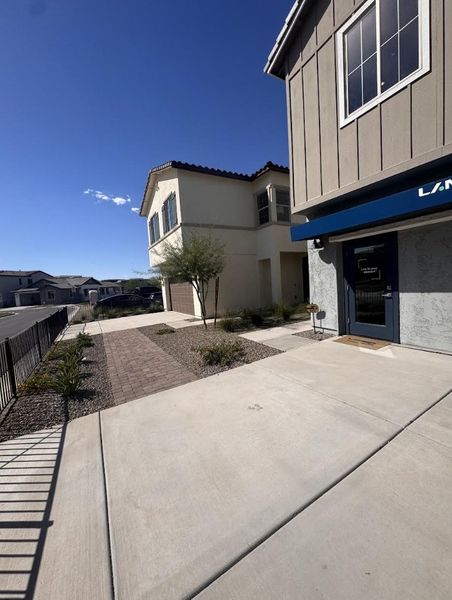 Charming two-story home with a landscaped path and modern façade in Greenpointe at Eastmark by Landsea Homes (Mesa, AZ).