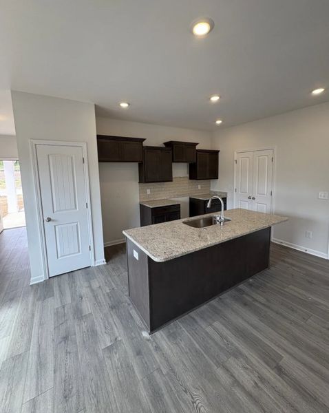 side by side stainless steel refrigerator, stove, dishwasher and microwave included