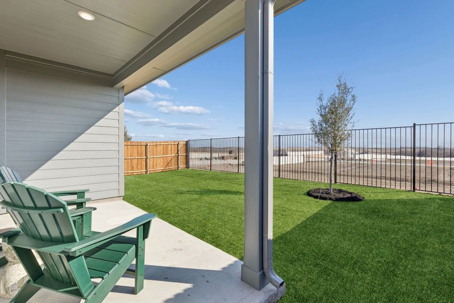 Covered Patio in a Nicholson Ranch Cedar Model Home in Lavon TX by Trophy Signature Homes