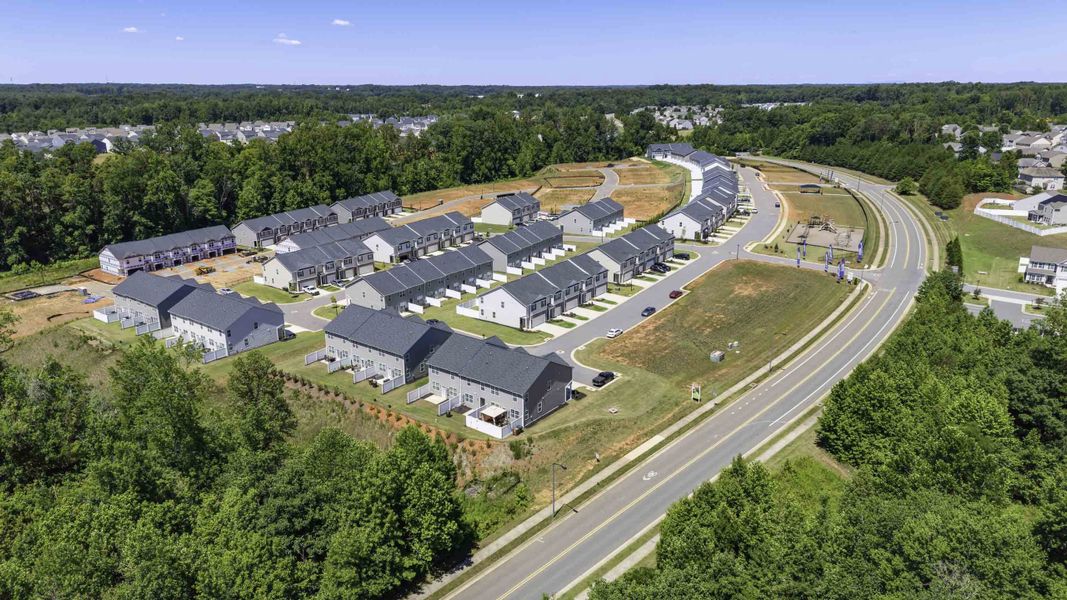 Aerial view of the North Village Townes community in Greensboro, NC, showing layout and nearby surroundings (Image 1). Aerial view of the North Village Townes community in Greensboro, NC, showing layout and nearby surroundings (Image 1).