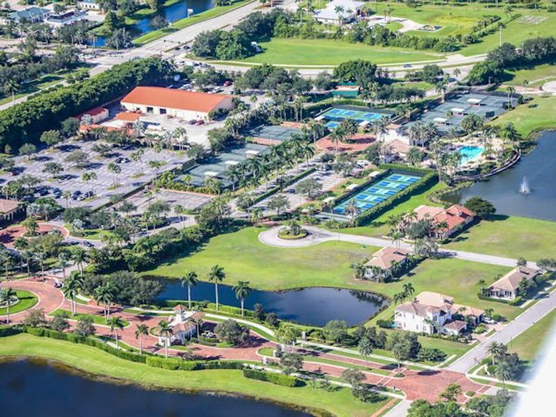 Aerial view of the Tesoro Club community in Port St. Lucie, FL, showing layout and nearby surroundings (Image 12).