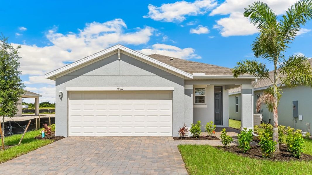 Front exterior of a home in the Cali Cove community, located in Punta Gorda, FL (Image 12).