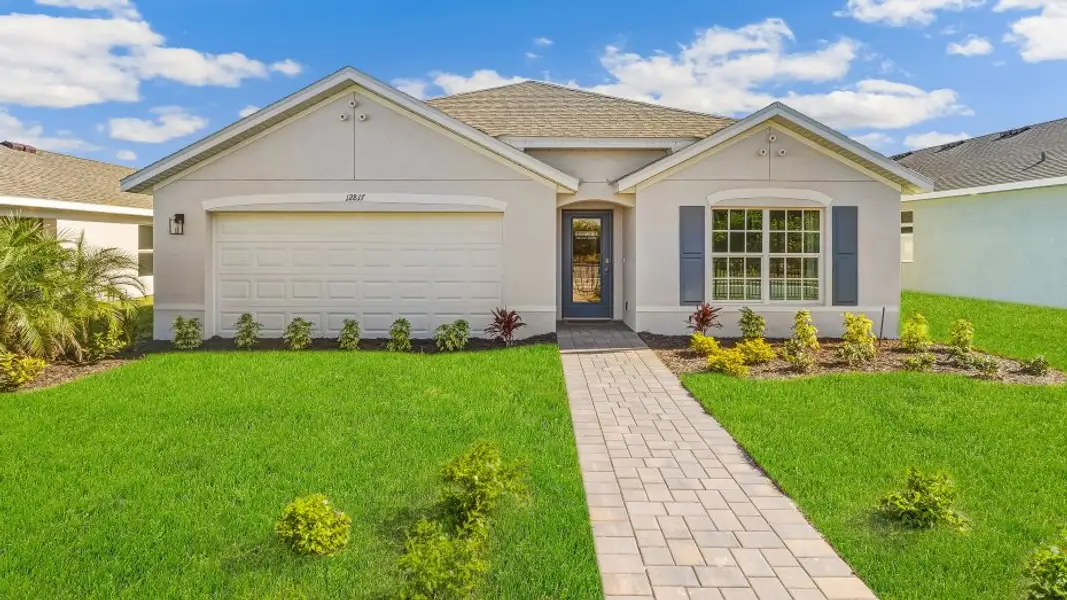 Front exterior of a home in the Coral Lakes - Tradition & Express community, located in Punta Gorda, FL (Image 2).