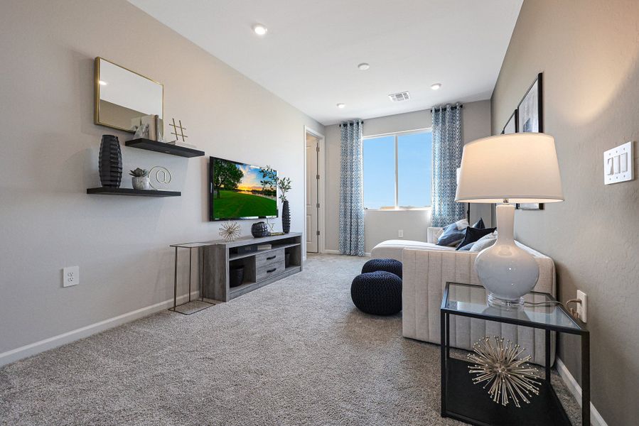 A living room with a tv and a lamp. A living room with a tv and a lamp.