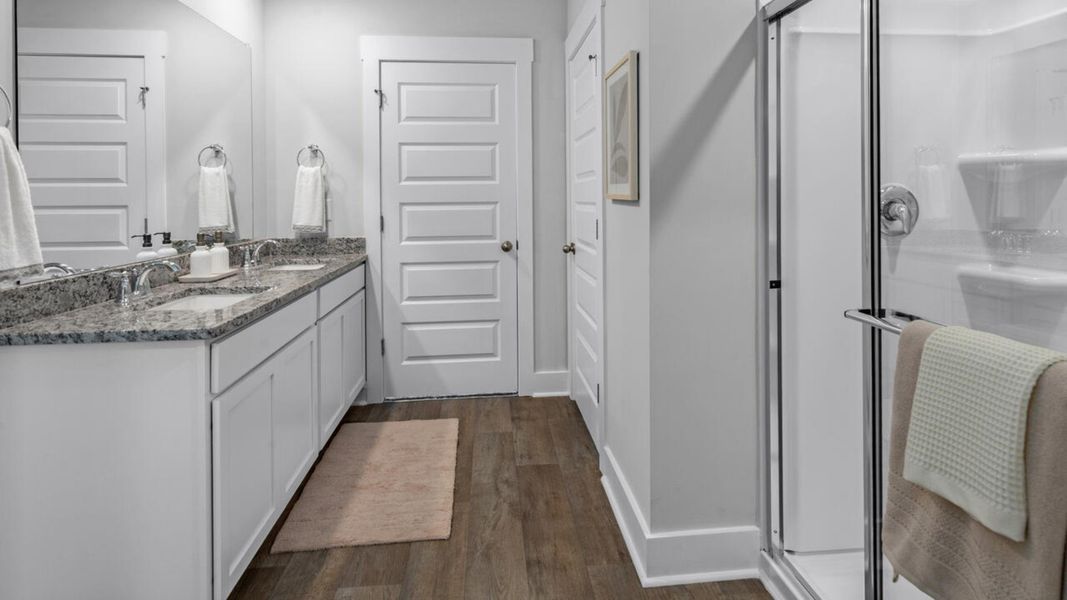 Furnished interior in a model home at Eagle Creek in Bolivia (Image 29).