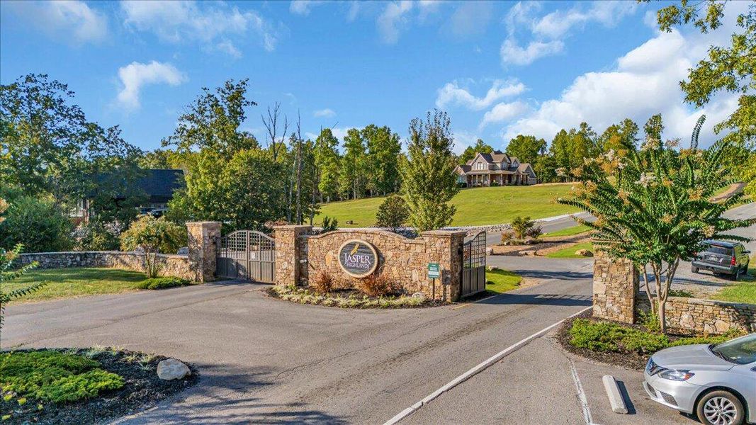 Entrance to the Jasper Highlands community in Guild, TN, featuring signage and landscaping (Image 1). Entrance to the Jasper Highlands community in Guild, TN, featuring signage and landscaping (Image 1).