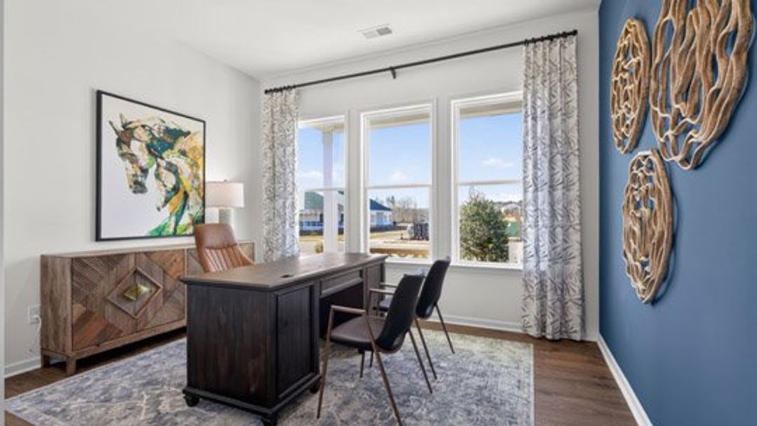 Furnished interior in a model home at The Villas at Galvins Ridge in Sanford (Image 28).